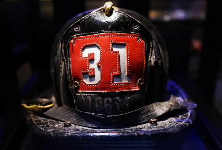 Surviving firefighter Dan Potter's fire helmet, which he used at Ground Zero on September 11, is viewed during a tour the National September 11 Memorial Museum on May 14, 2014 in New York City.