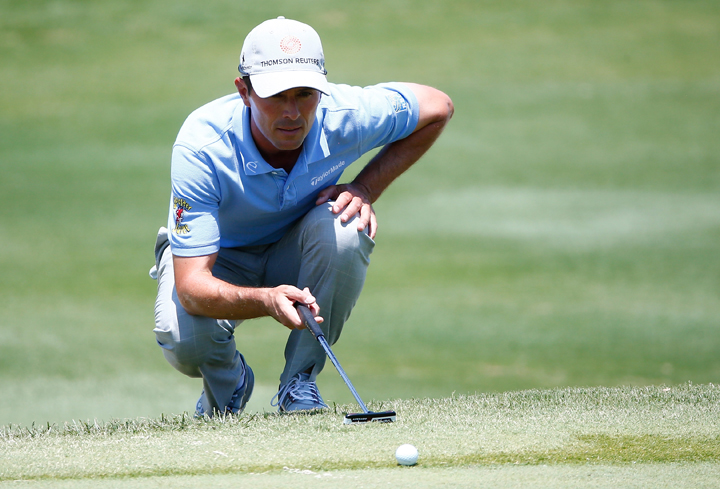 Mike Weir lines up a putt on the sixth hole during the final round of the HP Byron Nelson Championship at the TPC Four Seasons on May 18, 2014 in Irving, Texas.