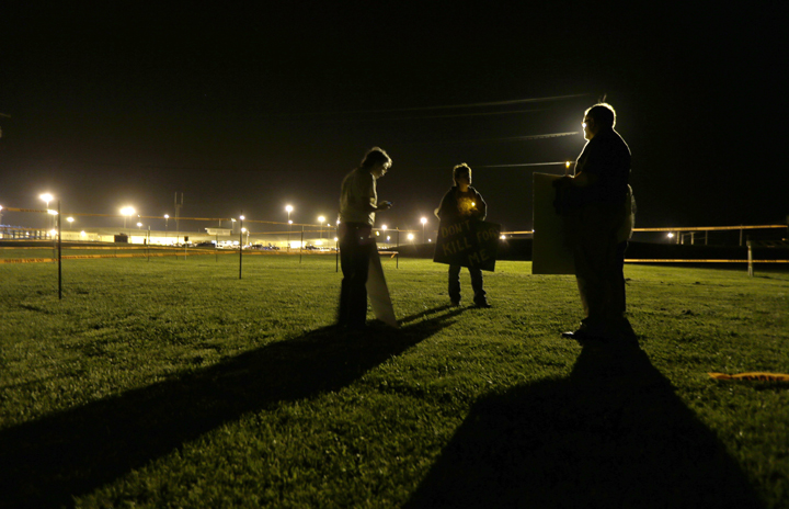 A group of death penalty opponents hold a vigil Tuesday, May 20, 2014, outside the prison where Missouri death row inmate Russell Bucklew was scheduled to be executed in Bonne Terre, Mo. 