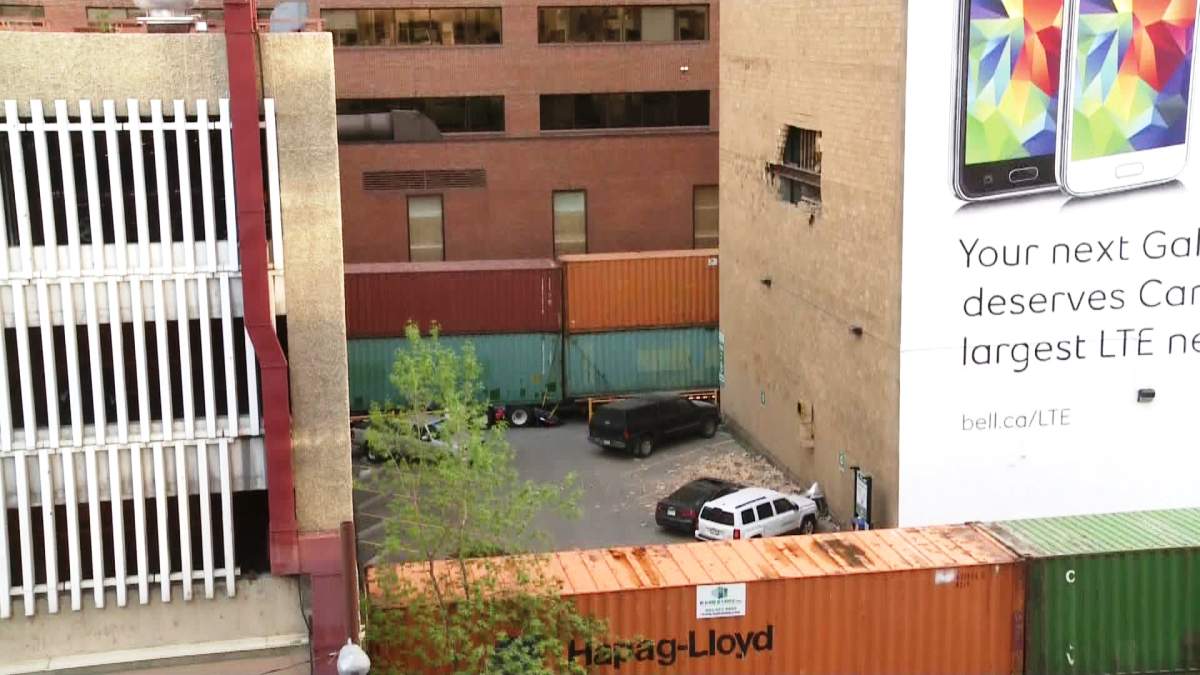 Crews work to repair a crumbling building located in the 600 block of 7th Street S.W.