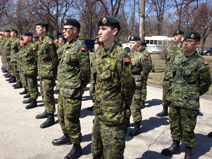 Military members participate in the National Day of Honour at Brookside Cemetery in Winnipeg on Friday to mark the end of Canada's mission in Afghanistan.