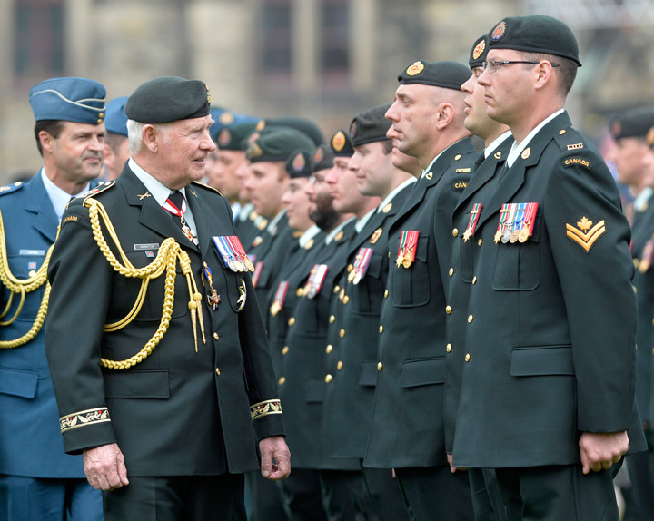Governor General David Johnston inspects an honour guard on Parliament Hill in Ottawa on Friday, May 9, 2014 during a ceremony to pay respects to the veterans and the dead of the Afghanistan war. 