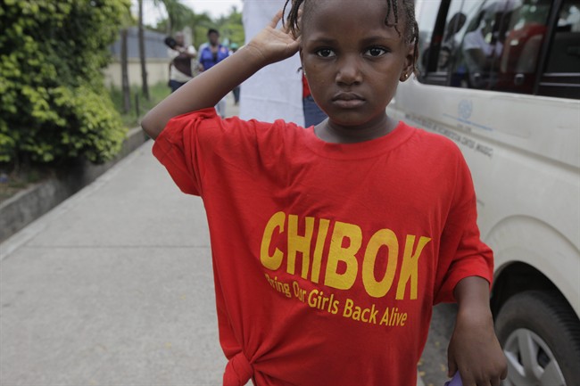 A girl wearing a T-Shirt with the inscription '' Chibok brings our girls back Alive'' attends a demonstration calling on government to rescue kidnapped school girls of a government secondary school Chibok, during workers day celebration in Lagos, Nigeria.