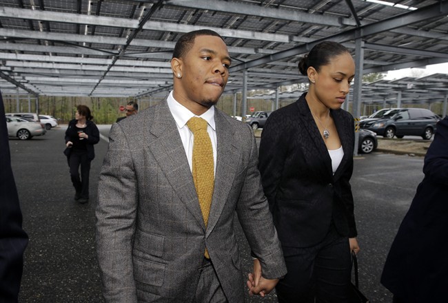 Baltimore Ravens football player and former Rutgers University standout, Ray Rice holds hands with his wife Janay Palmer as they arrive at Atlantic County Criminal Courthouse in Mays Landing, N.J., Thursday, May 1, 2014. (AP Photo/Mel Evans).
