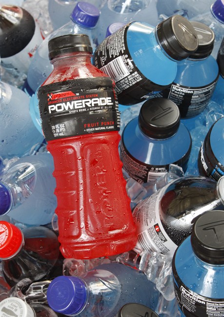 In this Aug. 5, 2010 file photo, bottles of Powerade sports drink and other Coca-Cola products are chilled over ice in Orlando, Fla.