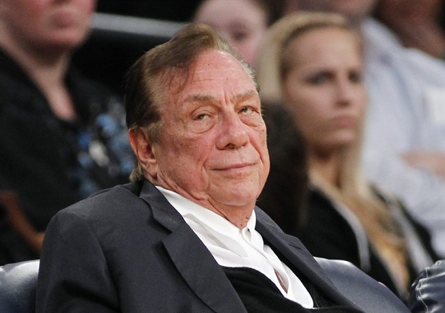This is a Dec. 19, 2011 file photo showing Los Angeles Clippers owner Donald Sterling watching the Clippers play the Los Angeles Lakers during an NBA preseason basketball game in Los Angeles.