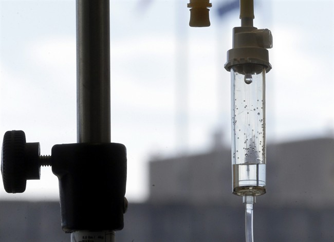  In this Sept. 5, 2013 file photo, an infusion drug to treat cancer is administered to a cancer patient via intravenous drip at Duke Cancer Center in Durham, N.C. According to a study that was discussed Saturday, May 31, 2014, at a cancer conference in Chicago.