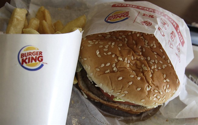 This Wednesday, June 20, 2012 file photo shows a burger and fries at a Burger King in Texas.