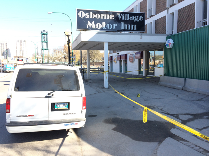 Police tape blocks off the Osborne Village Motor Inn on Thursday morning following an assault that left a man in critical condition.