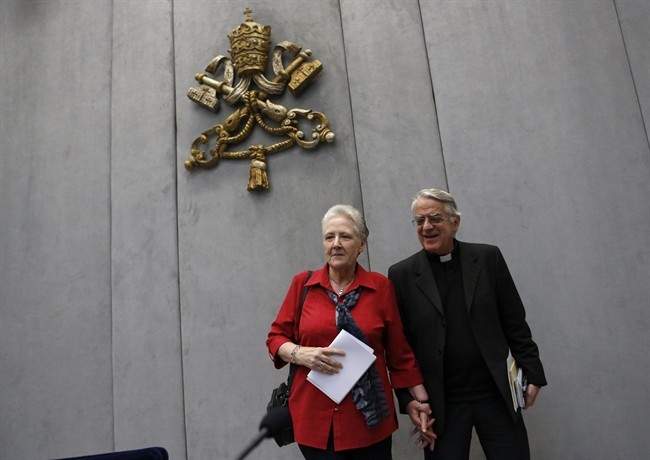 Marie Collins, left, and Vatican spokesman father Federico Lombardi leave at the end of a press conference at the Vatican, Saturday, May 3, 2014. 