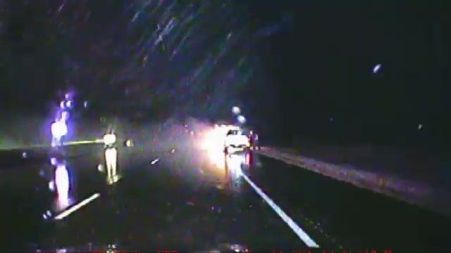 WATCH: Passerby helps police officer rescue woman from burning car ...