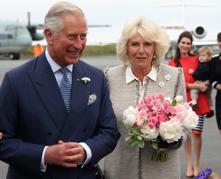 Camilla, Duchess of Cornwall and Prince Charles, Prince of Wales are presented with flowers as they arrive at Halifax Stanfield International Airport on May 18, 2014 in Halifax, Canada. 