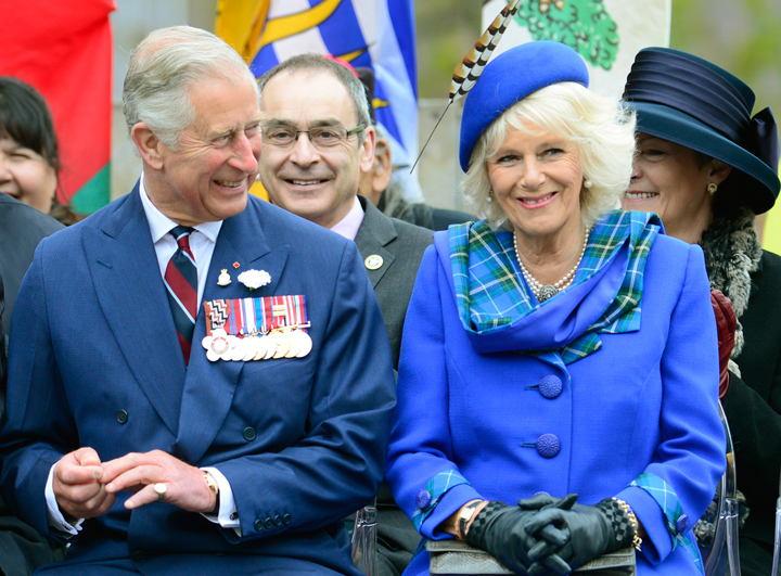 Prince Charles and his wife Camilla smile during an event in Halifax on Monday, May 19, 2014.