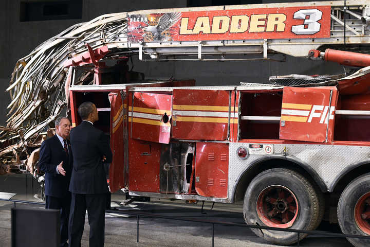 US President Barack Obama is accompanied by former New York Mayor Michael Bloomberg as he tours the National September 11 Memorial & Museum on May 15, 2014 in New York.