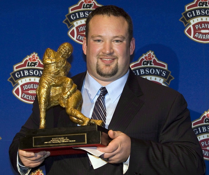 Montreal Alouettes Scott Flory holds his trophy for Outstanding Offensive Lineman at the CFL awards in Montreal Thursday, Nov.20 2008. 