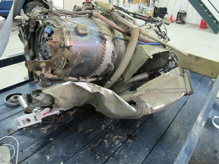The engine of the Cessna 208B that crashed near Snow Lake, Man., on Nov. 18, 2012, shows damage.