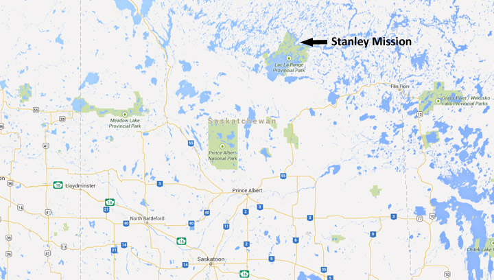 A fire that threatened the settlement of Stanley Mission has been contained as some evacuees arrive in Saskatoon.