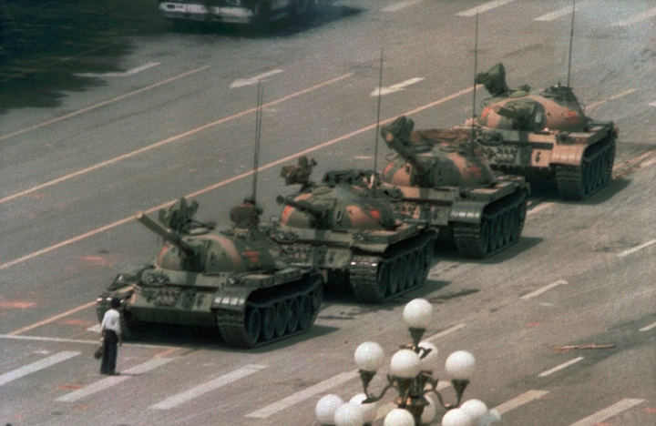 This is a June 5, 1989 file photo of a Chinese man as he stands alone to block a line of tanks heading east on Beijing's Cangan Blvd. in Tiananmen Square . 