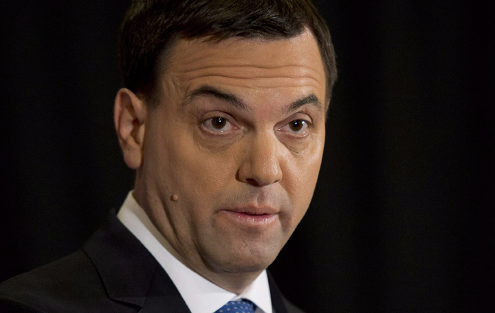 Ontario PC leader Tim Hudak speaks with the media during an availability on the campaign trail Thursday May 22, 2014 in Ottawa.