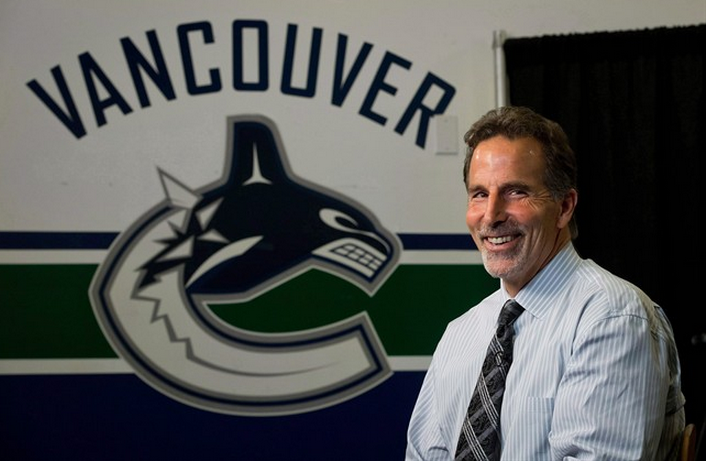 Vancouver Canucks' coach John Tortorella laughs during an interview following a news conference after he was hired by the NHL hockey team in Vancouver, B.C., on Tuesday June 25, 2013. THE CANADIAN PRESS/Darryl Dyck.