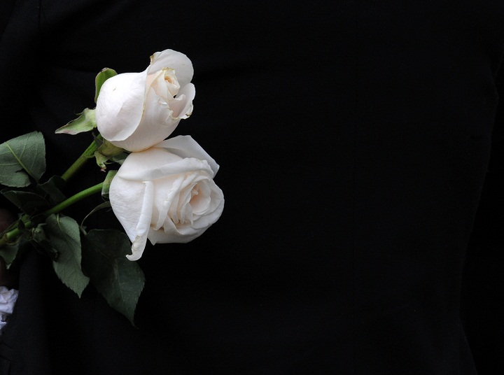 White roses at a funeral.