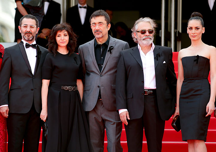 From left: Actress Demet Akbag, guest, writer Ebru Ceylan, director Nuri Bilge Ceylan, actor Haluk Bilginer, and actress Melisa Sozen attend the 'Winter Sleep' premiere in Cannes.