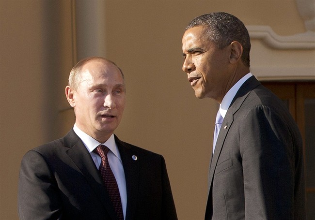 In this Sept. 5, 2013 file photo, President Barack Obama shakes hands with Russian President Vladimir Putin during arrivals for the G-20 summit at the Konstantin Palace in St. Petersburg, Russia.