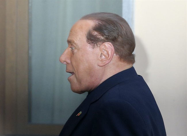 Former Italian premier Silvio Berlusconi arrives at the "Sacra Famiglia" foundation in Cesano Boscone, near Milan, Italy, to carry out a court order to help the elderly, Friday, May 9, 2014.