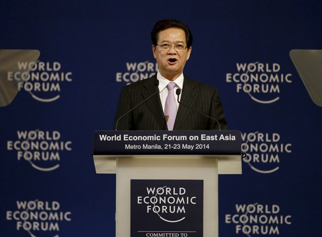 Vietnamese Prime Minister Nguyen Tan Dung addresses delegates at the opening of the two-day World Economic Forum on Asia Thursday, May 22, 2014 at the financial district of Makati, east of Manila, Philippines. (AP Photo/Bullit Marquez).