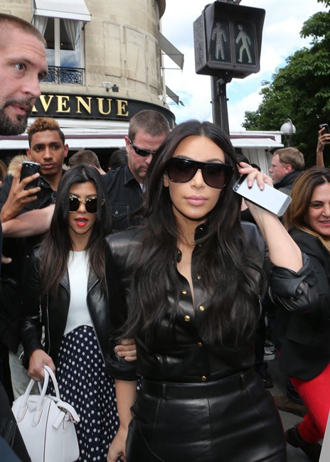 Kim Kardashian, seen here with her iPhone, professes her love for BlackBerry.