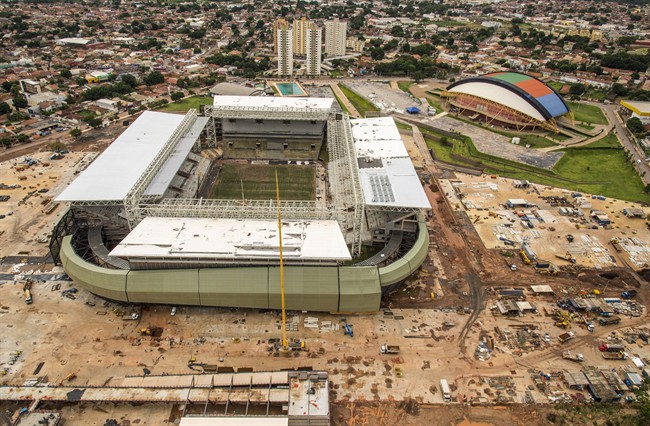 FILE - This Jan. 10, 2014 file photo, released by Portal da Copa, shows an aerial view of the Arena Pantanal in Cuiaba, Brazil. A worker at the World Cup stadium died Thursday, May 8, 2014 in an electrical accident, temporarily interrupting construction at Arena Pantanal, one of the most-delayed venues before the soccer tournament. (AP Photo/Portal da Copa, Jose Medeiros, File)