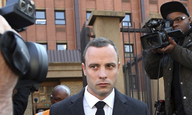 Oscar Pistorius leaves the high court in Pretoria, South Africa, Tuesday, May 20, 2014.