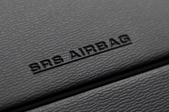 The airbag unit for the passenger seat of a Toyota Motor Corp. vehicle is seen at the company's showroom in Tokyo, Japan, on Thursday, April 11, 2013.