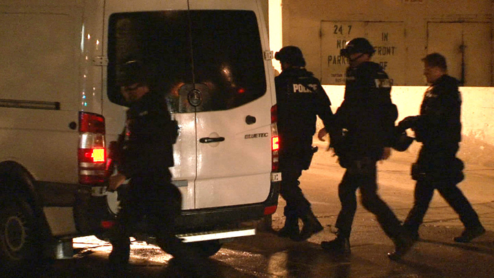 The Winnipeg police tactical unit leaves an investigation at 360 Cumberland Ave. on Sunday evening.