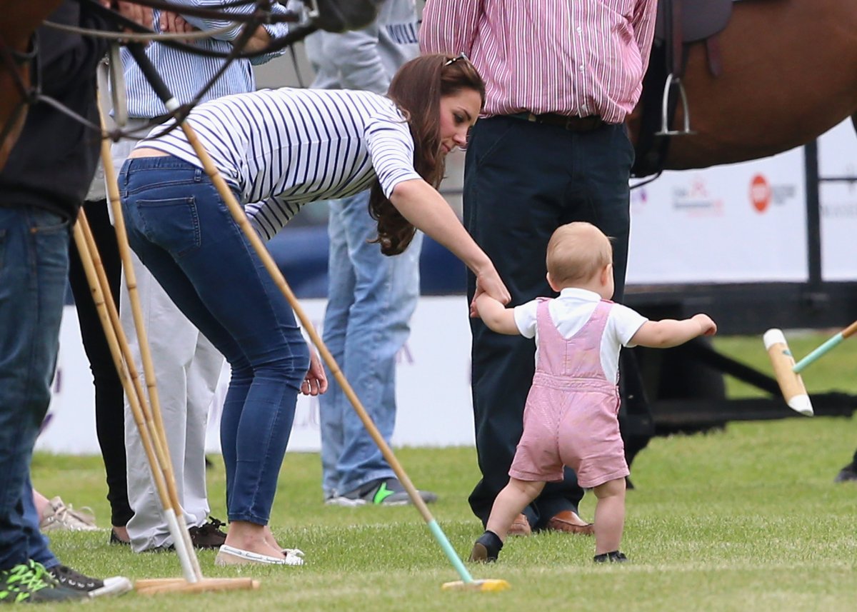 Kate Middleton helping son George walk.