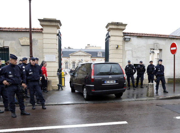 French police stand guard outside the Appeal court of Versailles, west of Paris, as Brussels shooting suspect Mehdi Nemmouche arrives to appear before the public prosecutor's office on June 4, 2014.