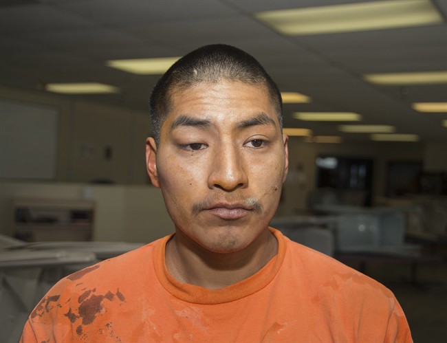 In this Thursday, Jan. 30, 2014 photo from the Arizona Department of Corrections, Jacob Harvey is shown shortly after he is accused of attacking a state prison teacher in Florence, Ariz. 