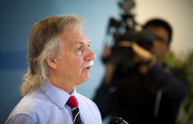 British Columbia Teachers' Federation President Jim Iker announces a full-scale strike for school teachers is set for Tuesday, June 17 during a press conference in Vancouver, B.C., on Thursday June 12, 2014. THE CANADIAN PRESS/Ben Nelms.