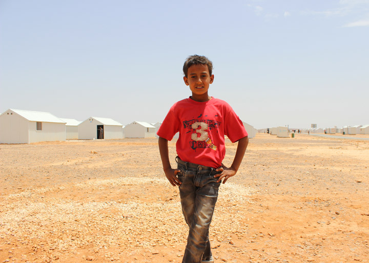 A boy poses in Azraq Camp