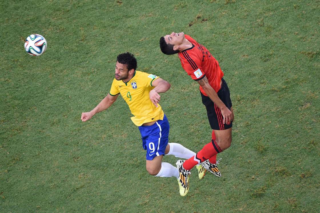 FORTALEZA, BRAZIL - JUNE 17: Fred of Brazil vies with Francisco Rodriguez of Mexico during the 2014 FIFA World Cup Brazil Group A match between Brazil and Mexico at Castelao on June 17, 2014 in Fortaleza, Brazil. (Photo by Pool/Getty Images)