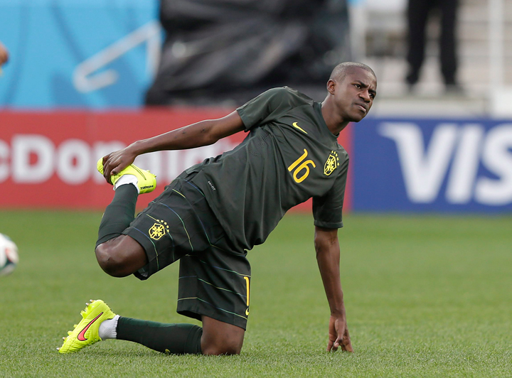 Brazil’s Ramires stretches during an official training session the day before the group A World Cup soccer match between Brazil and Croatia in the Itaquerao Stadium, Sao Paulo , Brazil, Wednesday, June 11, 2014.