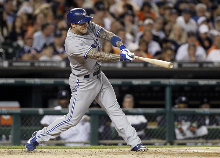 Brett Lawrie of the Toronto Blue Jays hits a three-run home run against the Detroit Tigers during the ninth inning at Comerica Park on June 3, 2014 in Detroit, Michigan.