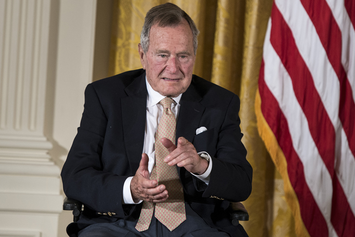 Former U.S. President George H. W. Bush points to his wife Barbara Bush during an event in the East Room of the White House July 15, 2013 in Washington, DC. 
