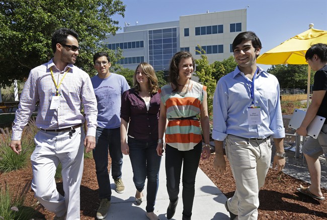 Google interns, from left, Steve Weddler, Alfredo Salinas, Lizzy Burl, Rita DeRaedt, and Alex Rodrigues walk on the Google campus.