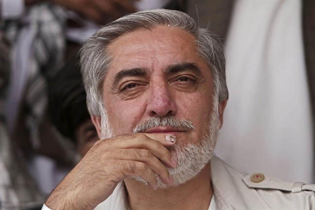 In this Saturday, May 24, 2014 file photo, Afghan presidential candidate Abdullah Abdullah listens to a speaker during a campaign rally in Paktiya province, east of Kabul, Afghanistan. 