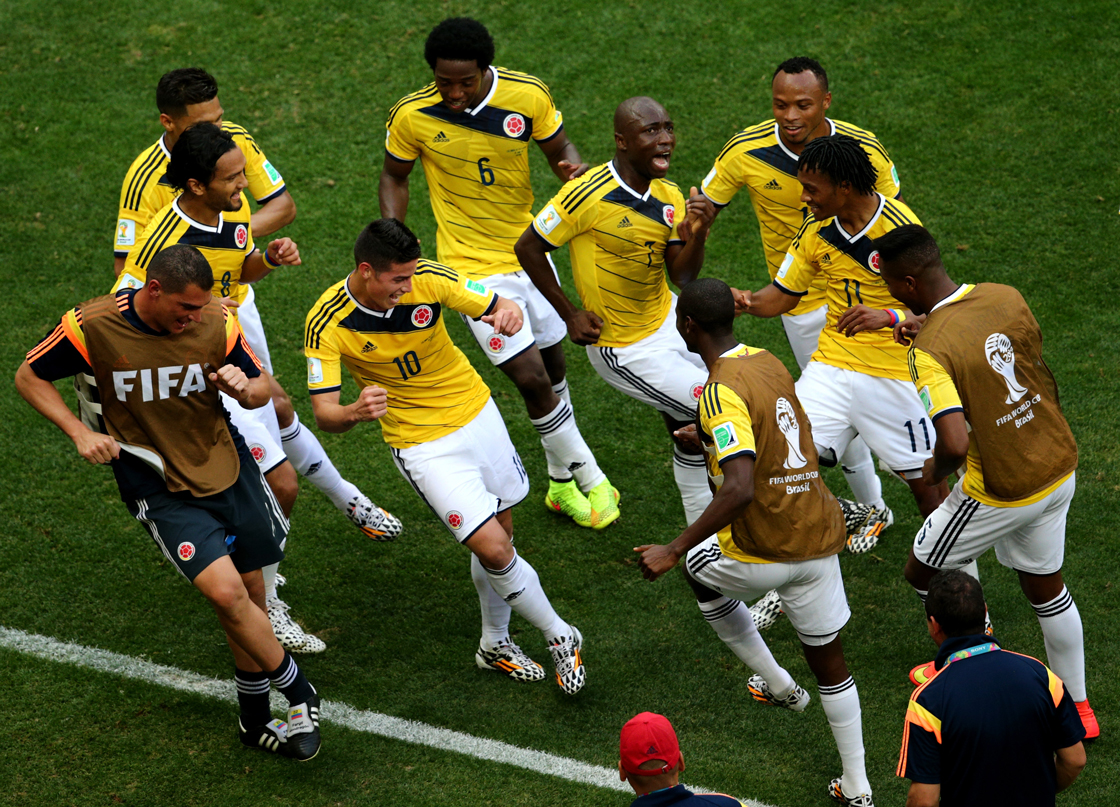 BRASILIA, BRAZIL - JUNE 19: James Rodriguez #10 of Colombia celebrates by dancing with teammates after scoring his team's first goal during the 2014 FIFA World Cup Brazil Group C match between Colombia and Cote D'Ivoire at Estadio Nacional on June 19, 2014 in Brasilia, Brazil. (Photo by Adam Pretty/Getty Images)