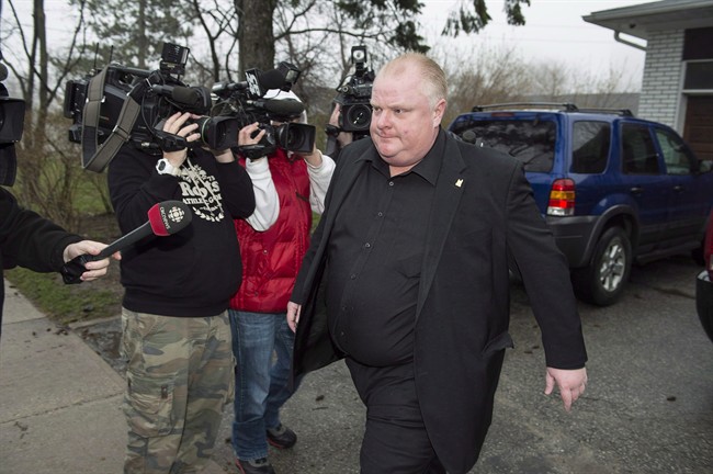 Toronto Mayor Rob Ford leave his home in Toronto, early Thursday, May 1, 2014. 