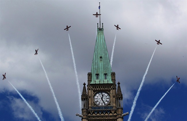 Canadian Snowbirds fly over top of the Peace Tower during Canada Day celebrations in Ottawa on July 1, 2011.