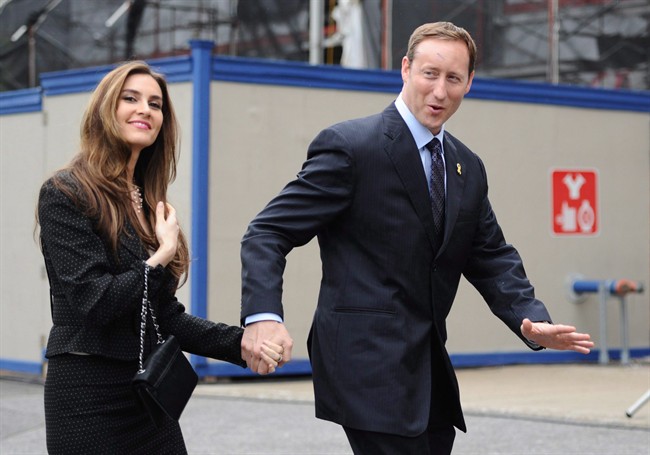 Peter MacKay arrives with his wife, Nazanin Afshin-Jam, for the swearing in of the federal cabinet at Rideau Hall in 2011.