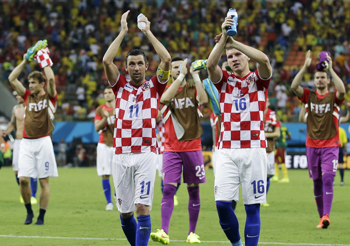 Croatian players applaud their supporters following their 4-0 victory over Cameroon during the group A World Cup soccer match between Cameroon and Croatia at the Arena da Amazonia in Manaus, Brazil, Wednesday, June 18, 2014.